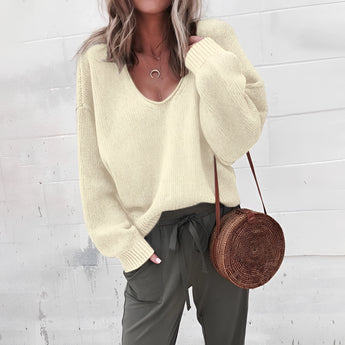 Women's oversized gray V-neck sweater featuring a relaxed fit, shown in a white color variant, size 2XL. The image highlights the sweater's knitted texture, long sleeves, and draped shoulder design, ideal for autumn wear.