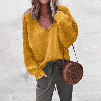 Woman wearing an oversized yellow V-neck sweater with a relaxed fit, featuring long sleeves and a casual autumn knitwear design in a 2XL size.