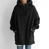 
Image of a women's oversized gray zip-up hoodie featuring a soft fabric and relaxed fit. The hoodie has a full-length zipper, long sleeves, and a pocket.