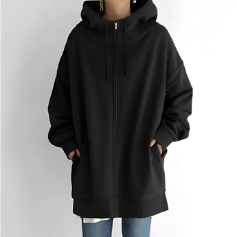 
Image of a women's oversized gray zip-up hoodie featuring a soft fabric and relaxed fit. The hoodie has a full-length zipper, long sleeves, and a pocket.