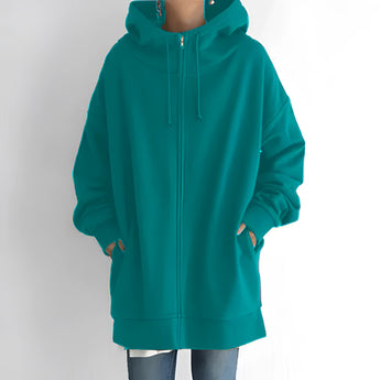 
An oversized green zip-up hoodie designed for women, featuring a relaxed fit. The hoodie is made from soft fabric and includes a full front zipper, long sleeves, and a comfortable collar.
