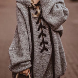 Oversized gray wool coat with toggle buttons, featuring a hood and long sleeves, suitable for winter fashion.