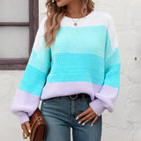 Women's oversized pastel striped knit sweater in cozy aqua and purple tones, featuring a relaxed fit with a crew neckline and long sleeves, ideal for a casual and fashionable look.
