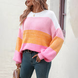 Women's oversized pastel striped knit sweater in cozy aqua and purple colors, featuring long sleeves and a relaxed fit. This stylish pullover sweater offers a comfortable and fashionable look, perfect for cooler weather.