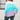 Women's oversized pastel striped knit sweater in cozy aqua and purple, featuring long sleeves and a relaxed fit.