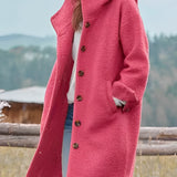 Oversized pink wool winter coat for women with chunky buttons, featuring a stylish design with wide shoulders, long sleeves, and a structured collar.