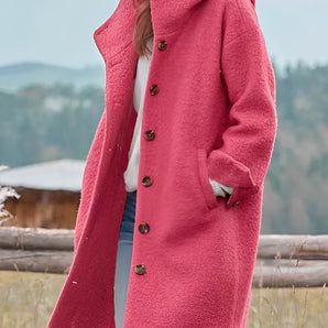 Oversized pink wool winter coat for women with chunky buttons, featuring a stylish design with wide shoulders, long sleeves, and a structured collar.