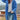 
A woman wearing an oversized pink wool winter coat with chunky buttons, modeled in a casual standing pose.