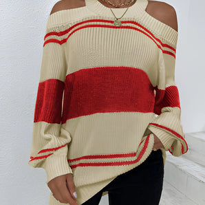 
A woman wearing an oversized red stripe off-shoulder sweater, showcasing autumn fashion with long sleeves and a relaxed fit.