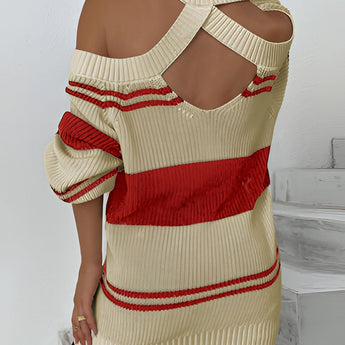 
A stylish women's oversized off-shoulder sweater featuring a red stripe pattern, perfect for autumn fashion. The sweater has long sleeves and a relaxed fit, accentuating the neckline and offering a comfortable and trendy look.