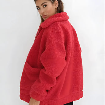 Women's oversized red teddy coat with a plush, woolen texture featuring a collar and long sleeves, designed for warmth during winter.