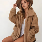 
A women's oversized khaki teddy coat in size 2XL, featuring a warm plush texture ideal for winter. The coat includes features such as a collar, long sleeves, and a comfortable fit, perfect for cold weather.