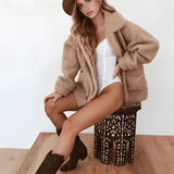 Women's oversized red teddy coat, featuring a warm plush texture, long sleeves, and a cozy design ideal for winter weather.