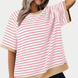 
A pink oversized striped tee for women, featuring a casual loose fit design, with details emphasizing the shoulder and waist areas.