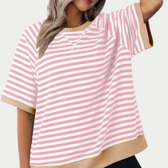 
A pink oversized striped tee for women, featuring a casual loose fit design, with details emphasizing the shoulder and waist areas.