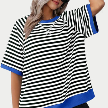 Women's oversized striped tee in blue, featuring a casual loose fit with white stripes. The T-shirt has short sleeves and a round neckline, ideal for a relaxed and fashionable look. Suitable for size 2XL, it offers comfortable wear and a stylish appearance.