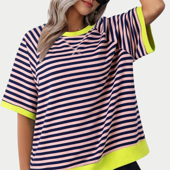 Women's oversized striped tee in pink and yellow, featuring a casual loose fit with short sleeves and a round neckline, showcased on a mannequin against a white background.