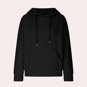 Oversized black hoodie with a textured design, featuring long sleeves and a loose fit, suitable for a casual look.