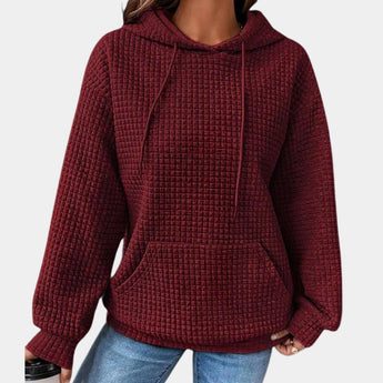 Women's oversized textured hoodie in a wine red color, featuring a casual loose fit with long sleeves and a soft, comfortable fabric.