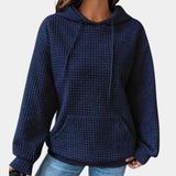 Women's oversized blue textured hoodie in a casual loose fit style, featuring long sleeves and a comfortable neckline.