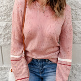 Women's pastel pink knit sweater featuring a cozy and lightweight design, with a casual pullover style, long sleeves, and a round collar.