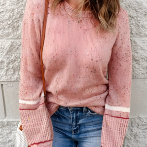 Women's pastel pink knit sweater featuring a cozy and lightweight design, with a casual pullover style, long sleeves, and a round collar.