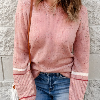 Women's pastel pink knit sweater featuring a cozy and lightweight design, with a casual pullover style, long sleeves, and a round collar.