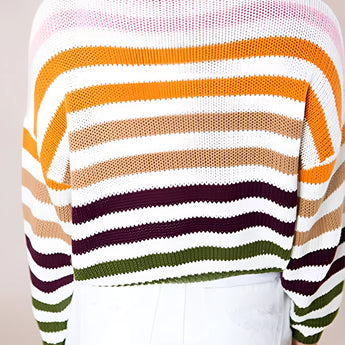 A women's lightweight sweater featuring pastel stripes in a knit design, with a crew neck and long sleeves.