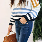 Women's pastel striped knit crew neck lightweight sweater with long sleeves, paired with white jeans, showcasing a fashionable and casual look.