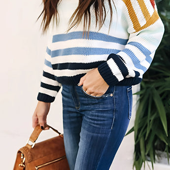 Women's pastel striped knit crew neck lightweight sweater with long sleeves, paired with white jeans, showcasing a fashionable and casual look.