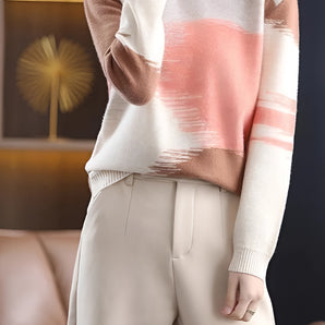 Women's fashion pastel tie-dye sweater in blush pink and white, featuring a trendy pullover design with a round neck and long sleeves.