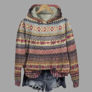 Women's patterned winter hoodie in brown, boho style, made from a cozy alpaca blend featuring a colorful and intricate pattern with magenta and electric blue accents. The hoodie has long sleeves and a comfortable collar, designed for fashion-forward individuals seeking warmth and style in size 5XL.