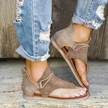 Women's peep-toe wraparound ankle sandals in earth tone, styled with a bohemian flair, shown in color Cachi and size 43. The sandals are flat and feature a wraparound design at the ankle.
