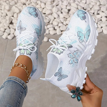 Women's green running shoes with a mesh design, featuring a pink floral pattern, lightweight and breathable, displayed in size 43.