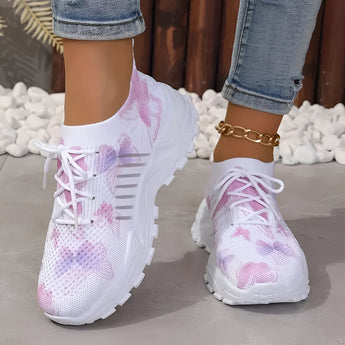 Women's pink floral mesh running shoes in size 43, showcasing a lightweight and breathable design with a fashionable pink and purple floral pattern. The sneakers are displayed against a white background, highlighting their stylish and modern appearance.