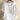 
White oversized short sleeve casual blouse for women with a round neck and subtle collar detailing.