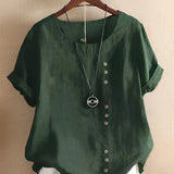 
A women's oversized casual blouse in dark green, featuring short sleeves and a comfortable fit, designed with a classic neck and collar style.