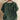 
A women's oversized casual blouse in dark green, featuring short sleeves and a comfortable fit, designed with a classic neck and collar style.