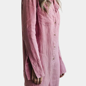 A woman wearing a pink oversized long sleeve linen shirt, styled casually with jeans. The shirt features a breathable fabric with a collar and button-down design, offering a comfortable and relaxed look.
