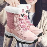Women's pink quilted fur-lined waterproof winter boots featuring a stylish design, ideal for outdoor activities and cold weather.
