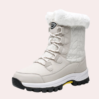 Women's pink quilted waterproof winter boots with fur lining and synthetic rubber soles, designed for outdoor use and walking, shown in size 42.