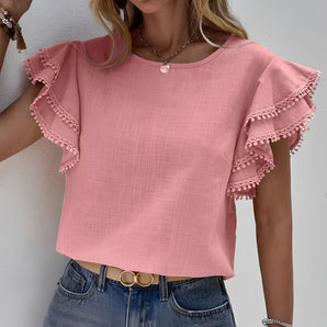 
A stylish women's pink ruffle sleeve blouse featuring chic summer design with tassels, showcasing detailed ruffles on the sleeves, and a flattering neckline.