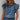 Women's ocean blue ruffle sleeve blouse in size 2XL with tassels, showcasing shoulder and neck detailing, designed as a chic summer top.