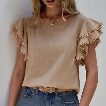 Women's pink ruffle sleeve blouse featuring chic tassels, styled in the khaki color variant in size 2XL, displayed on a mannequin with emphasis on the detailed ruffle sleeves and the relaxed fit.