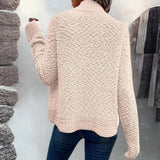 
A woman wearing a pink fluffy teddy coat, suitable for cozy winter wear, with the jacket featuring plush texture, long sleeves, and a comfortable fit.