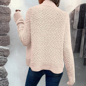 
A woman wearing a pink fluffy teddy coat, suitable for cozy winter wear, with the jacket featuring plush texture, long sleeves, and a comfortable fit.