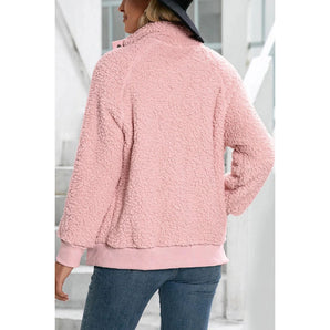 Women's pink teddy fleece jacket featuring a cozy soft sherpa texture with a zip-up front. The jacket has long sleeves, a collar, and provides warmth and comfort.