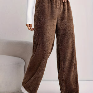 Women's plush brown fleece lounge pants featuring a cozy wide-leg design.