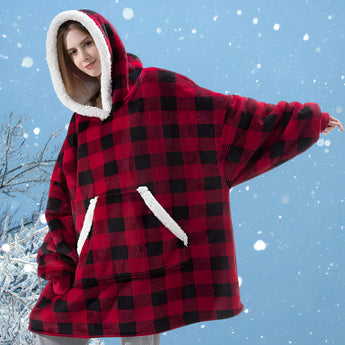 Women's oversized fleece hooded robe in a red and black tartan plaid pattern, designed for warmth and comfort during winter, with long sleeves and a plush texture.