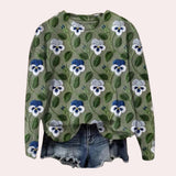 A women's crewneck sweater in a vibrant purple color featuring intricate floral embroidery, displayed on a plain background. The sweater has long sleeves and a classic crew neckline, offering a stylish and cozy look.